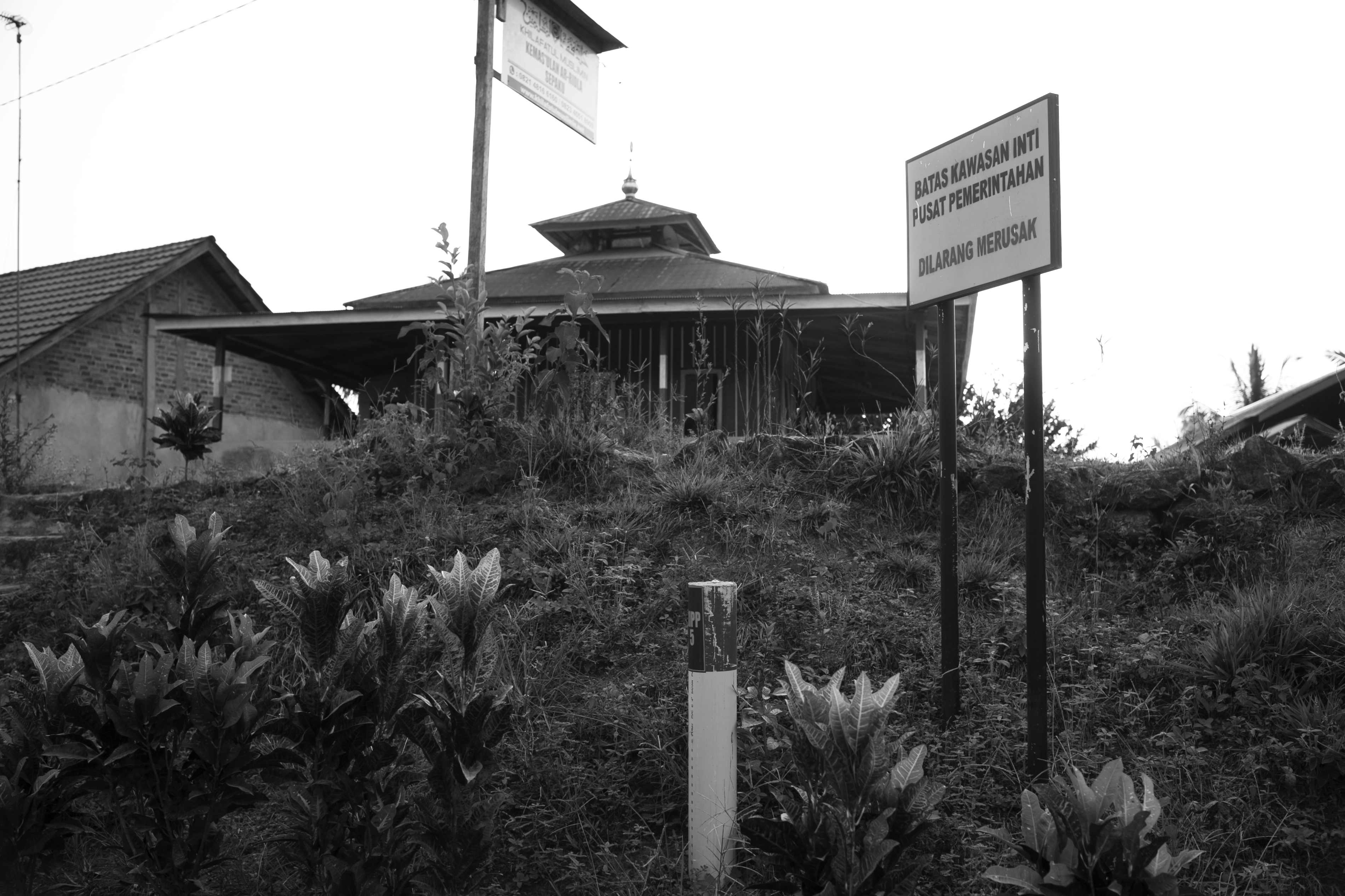 Warning signs mark the border of the Central Government Area of the planned new capital. People living in this area are to be relocated. (Project Multatuli)