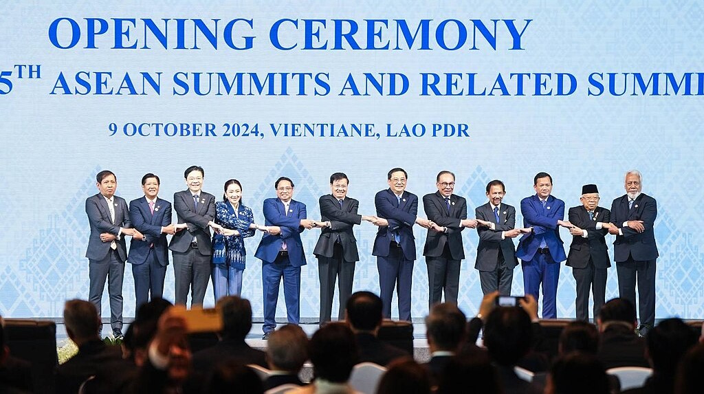 The leaders of the Association of Southeast Asian Nations (ASEAN) pose for a family picture doing the signature 