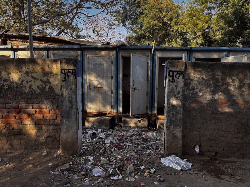 Neglected toilet facilities in Majnu Ka Tilla refugee colony, with overflowing garbage highlighting the lack of proper sanitation. Photo: Shivalika Puri