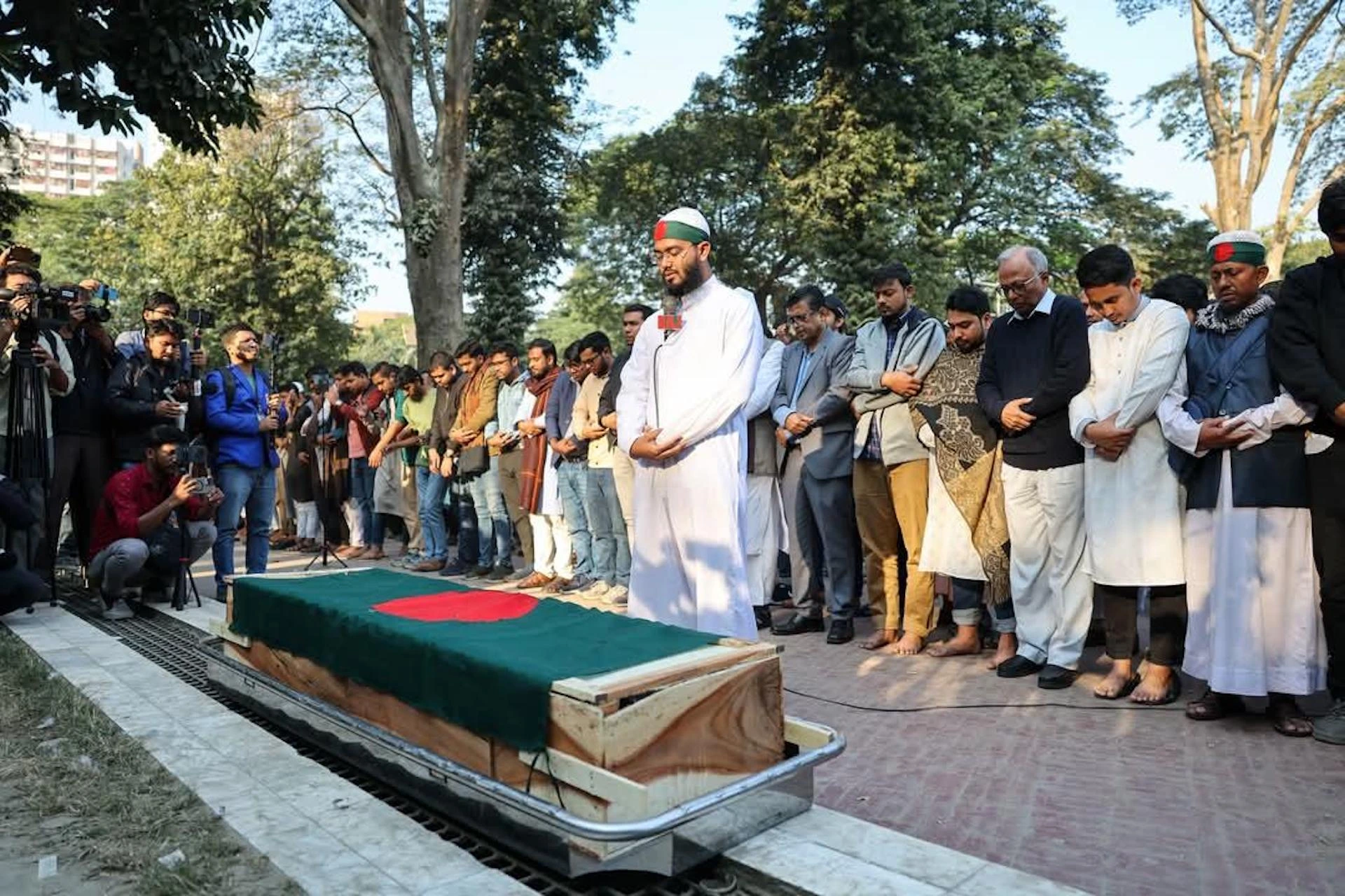 Members of Yunus’s interim government attend the final rites of a 12-year-old boy called Arafat, who was shot during the anti-government protests last year. Photo: Photo: ChiefAdviserGoB/X