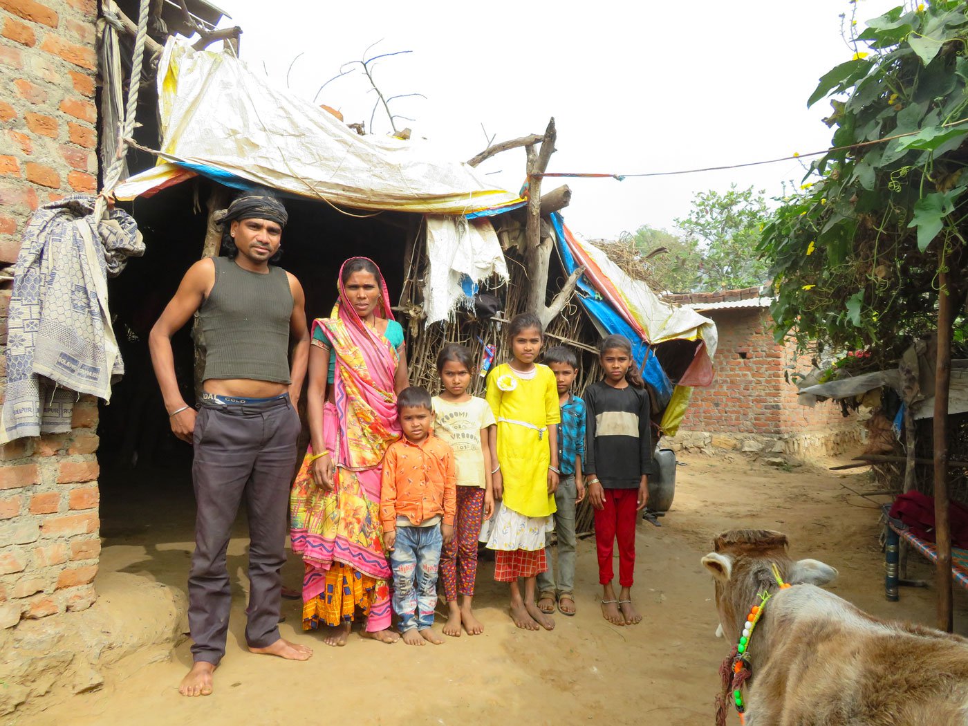 Maria and Paaru with their family at home in Dungra Chhota, Banswara district. Photo: Priti David/PARI