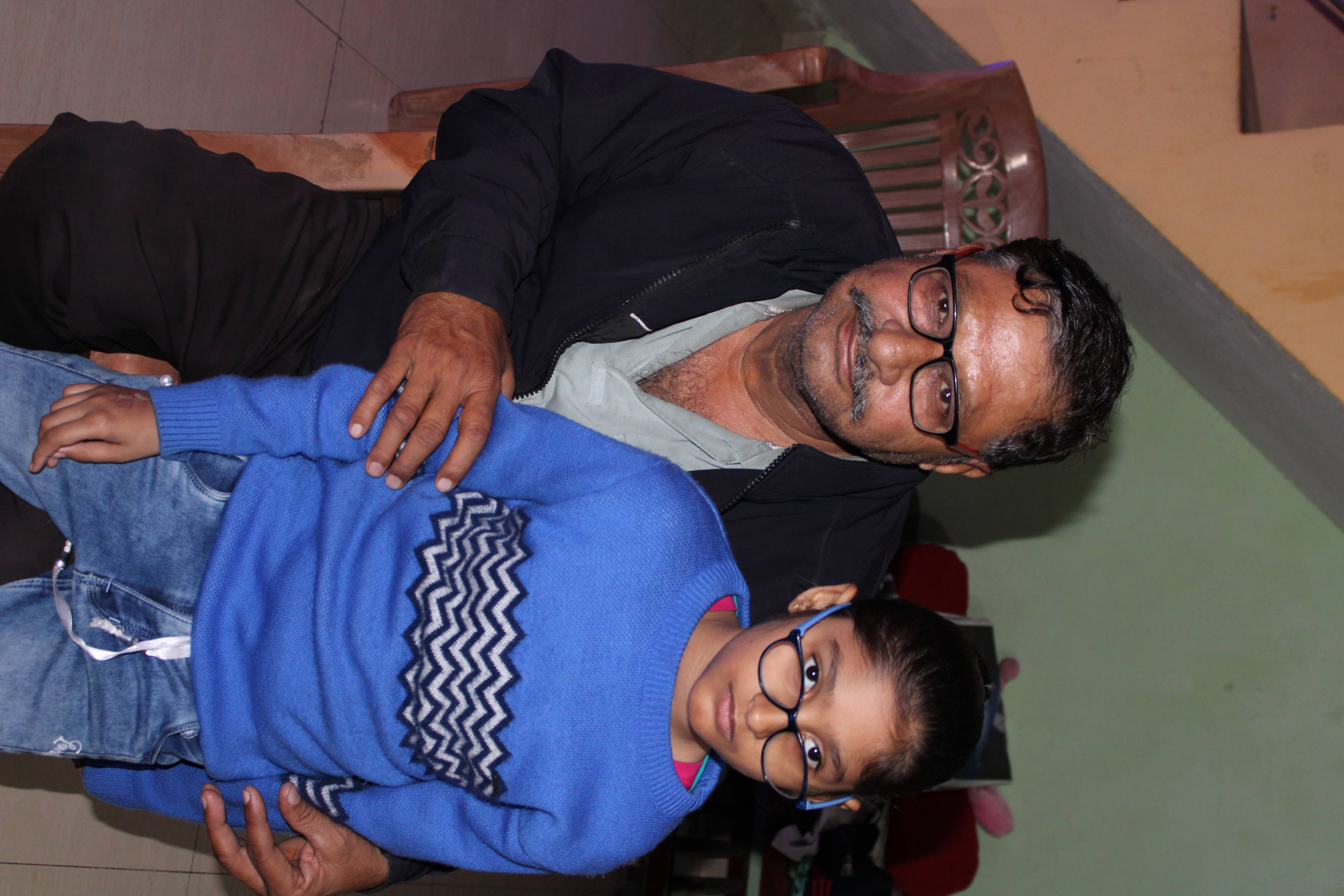 Bhagwati Parshad Pandey and his granddaughter Sia in Bhopal’s Brij Vihar colony. Photo: Tulika