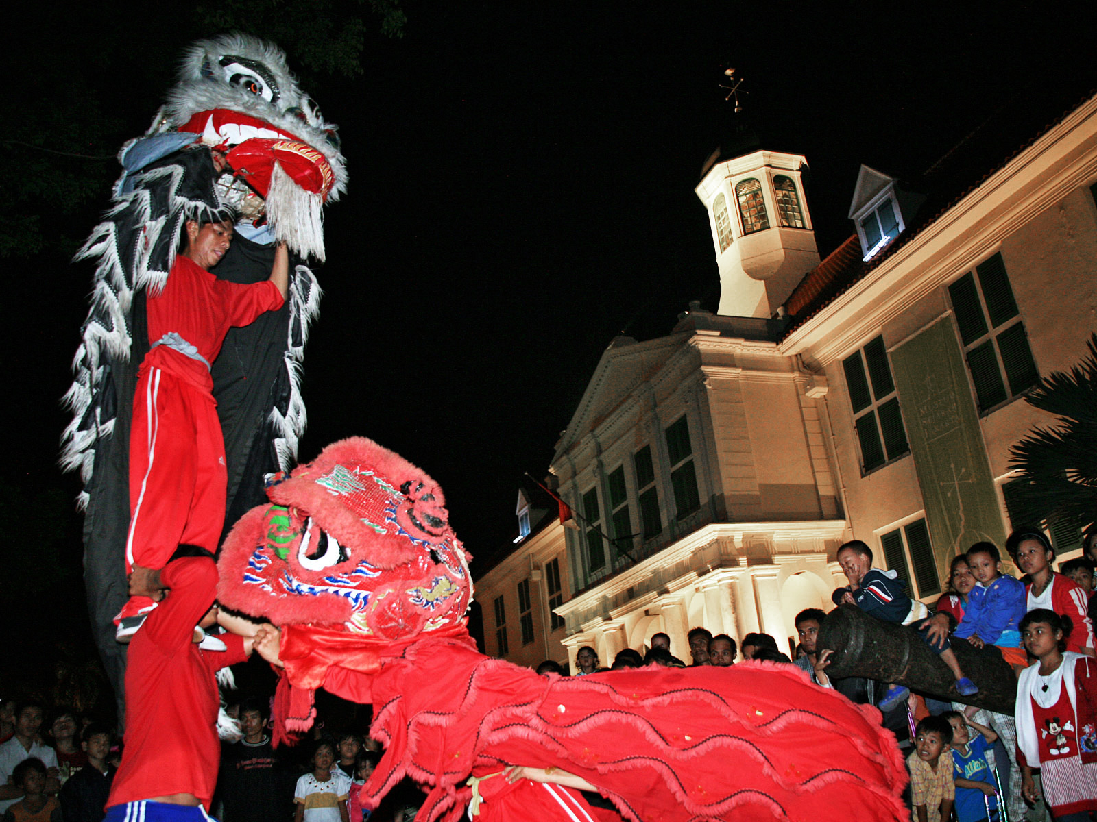 A group of barongsai (lion dance) performers play in front of the Fatahillah Park in Jakarta. Presidential Instruction No. 14/1967 on Chinese Religions, Beliefs, and Traditions once prohibited Chinese-Indonesians from practicing religious and cultural traditions rooted in their ancestral heritage, including barongsai. Even after the instruction was officially revoked by Presidential Decree No. 6/2000, the discriminatory policy has left many young Chinese-Indonesians disconnected from their cultural identity. Photo: Ricky Yudhistira/Project Multatuli