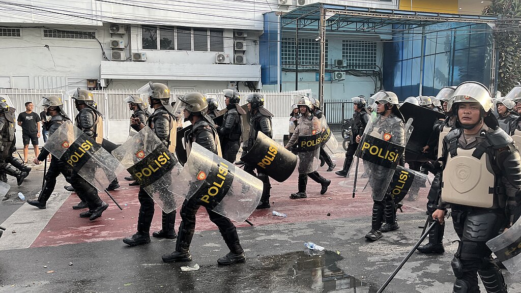 Riot police walking by in Medan, Indonesia, on August 29, 2025. Photo: Wikimedia Commons