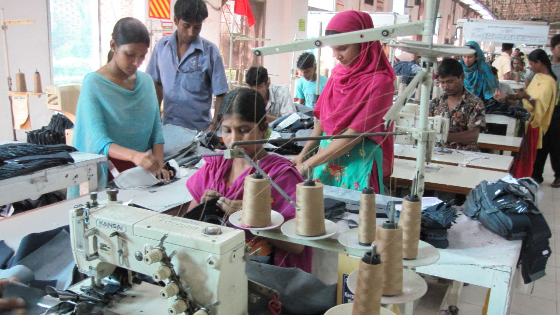 Textile workers in a factory outside Dhaka, Bangladesh. Photo: Mona Mijthab/Wikimedia Commons